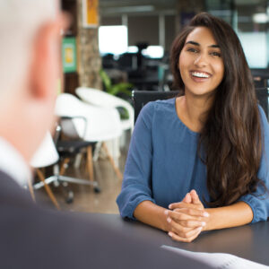 Young female candidate laughing at job interview